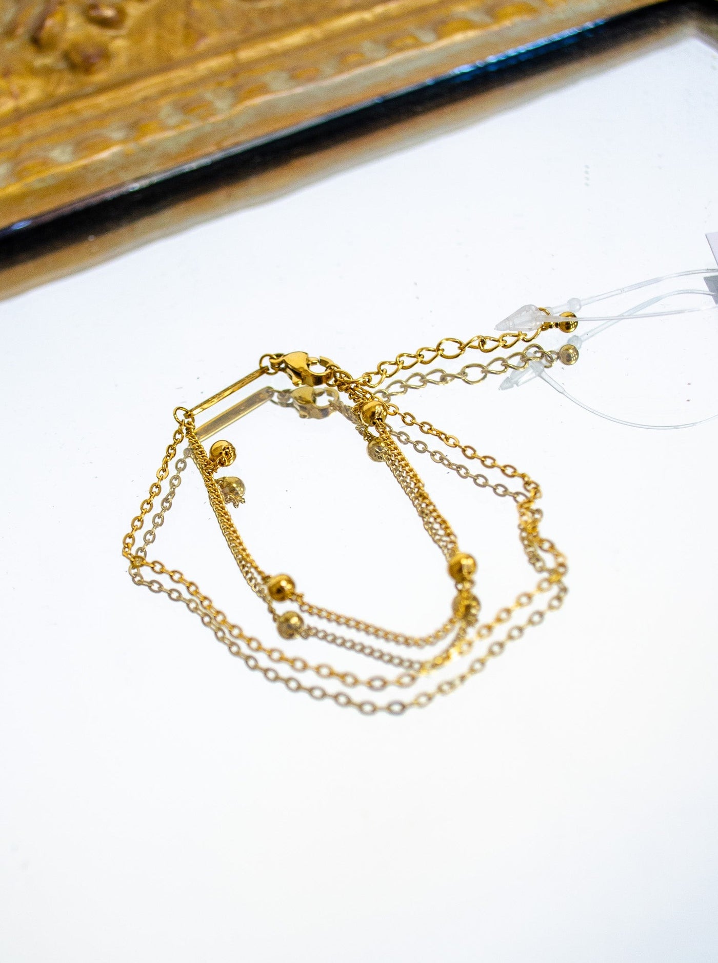 Gold double chain bracelet.