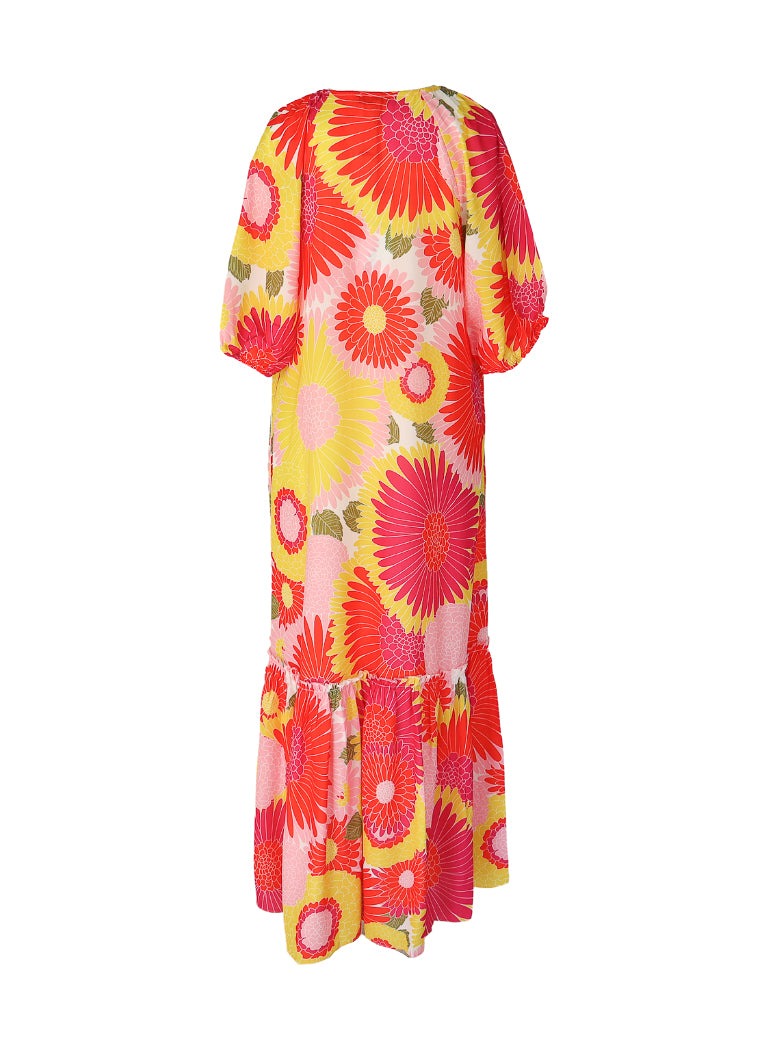 Long floral print multi color maxi dress with puffy half sleeves, split neck with a tie, and roushing on the bottom tier of dress.