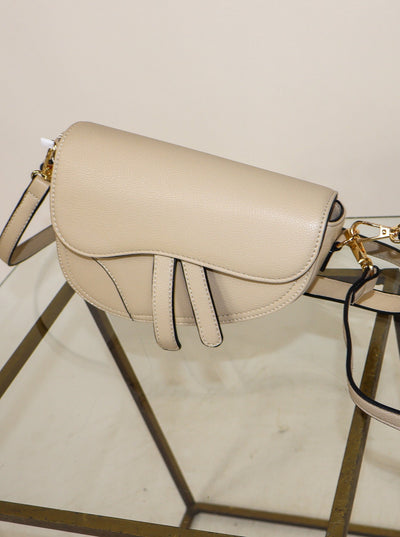 Cream Dior inspired crossbody saddle bag. 