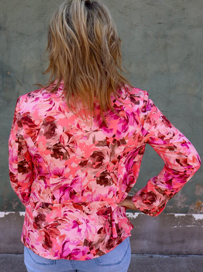 Pink floral printed collared blazer.