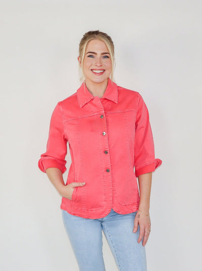 Model is wearing a coral fitted collared jacket. Worn with blue jeans. 
