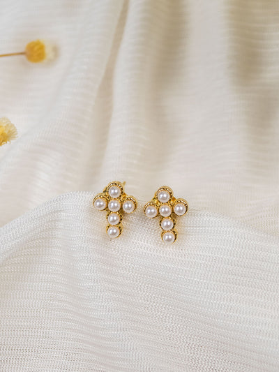 A pair of gold mini pearl cross studs.