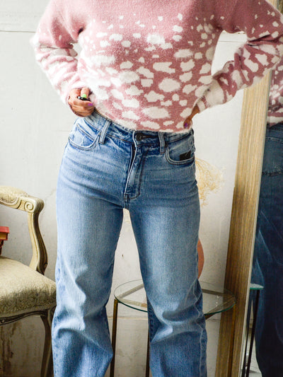 A light wash jean that is wide leg and high rise.