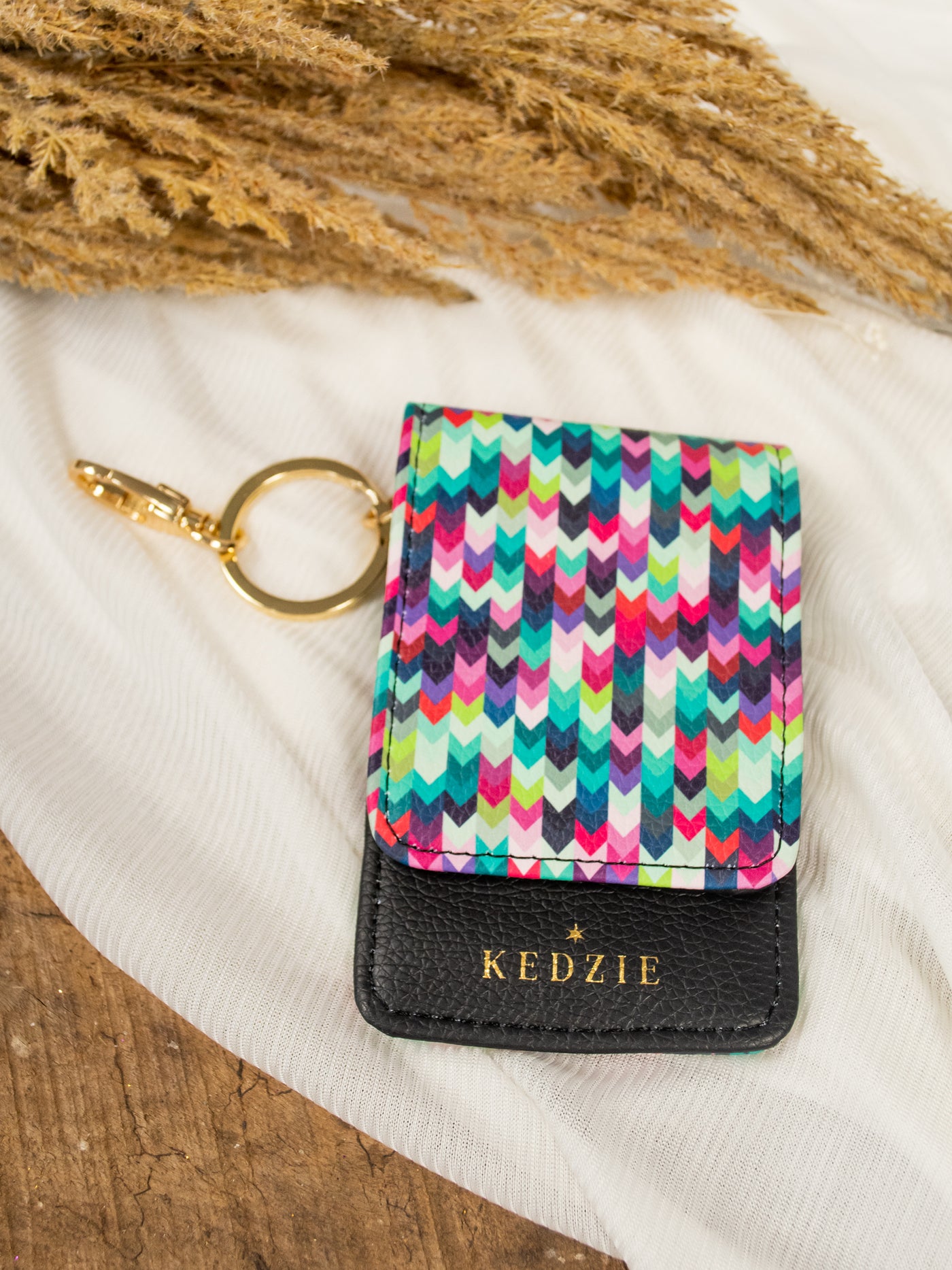 A multicolor and black id holder keychain.