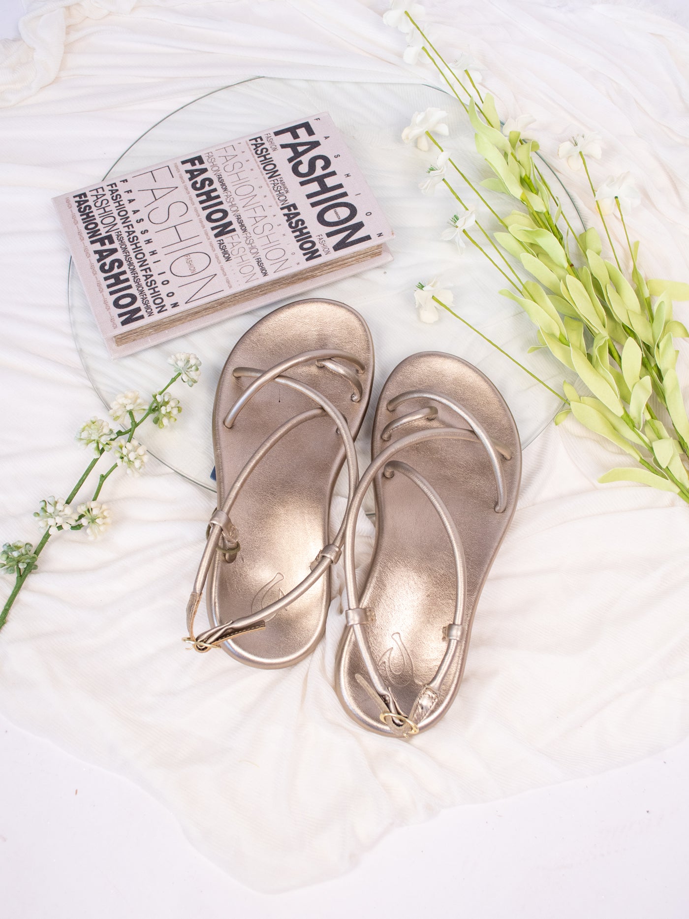 Strappy gold slingback sandals.