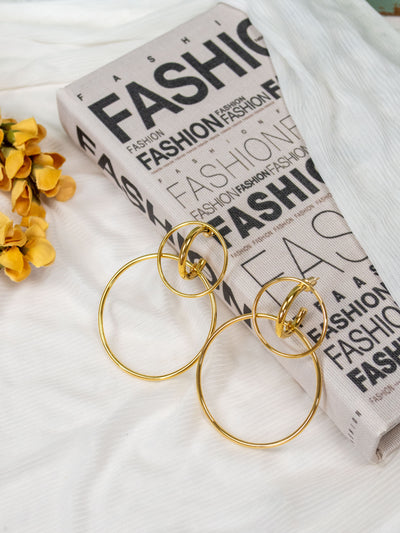 A gold double hoop statement earring.