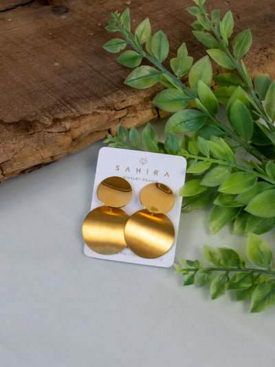 A gold plated circular design drop earring.