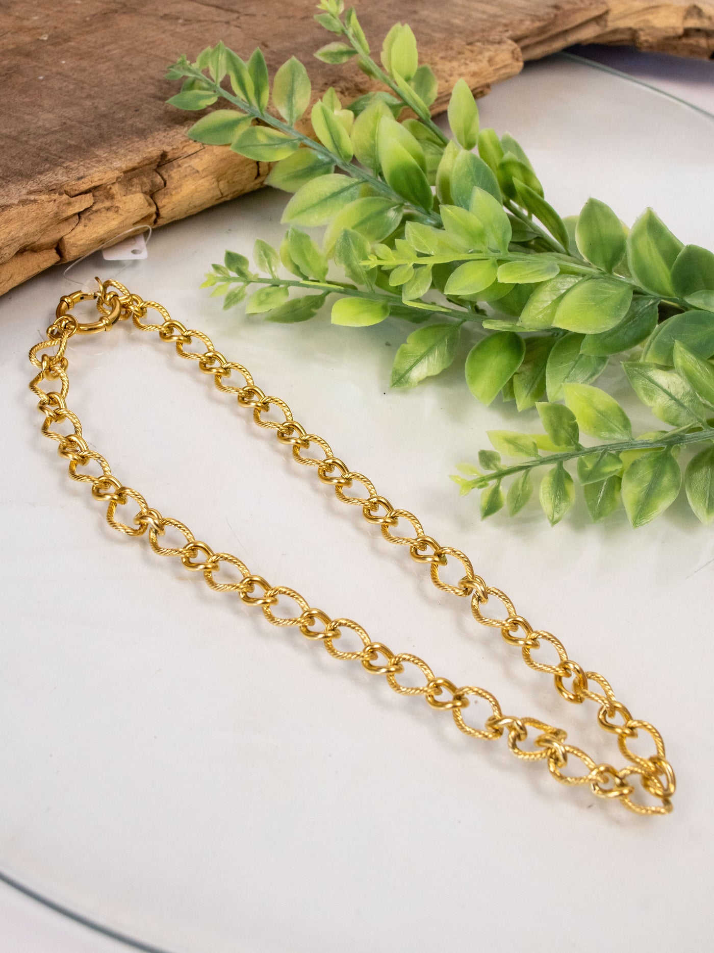 A gold plated chain link necklace with a large clasp. It is 16 inches.