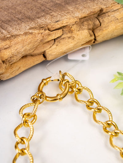 A gold plated chain link necklace with a large clasp. It is 16 inches.