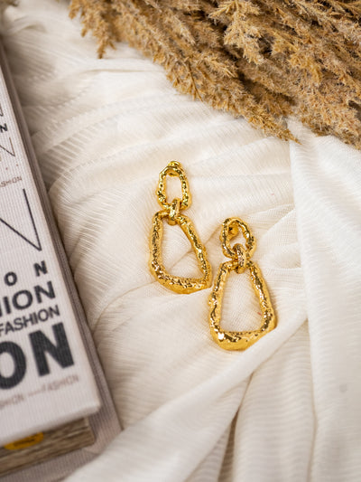 A pair of textured gold drop earrings.